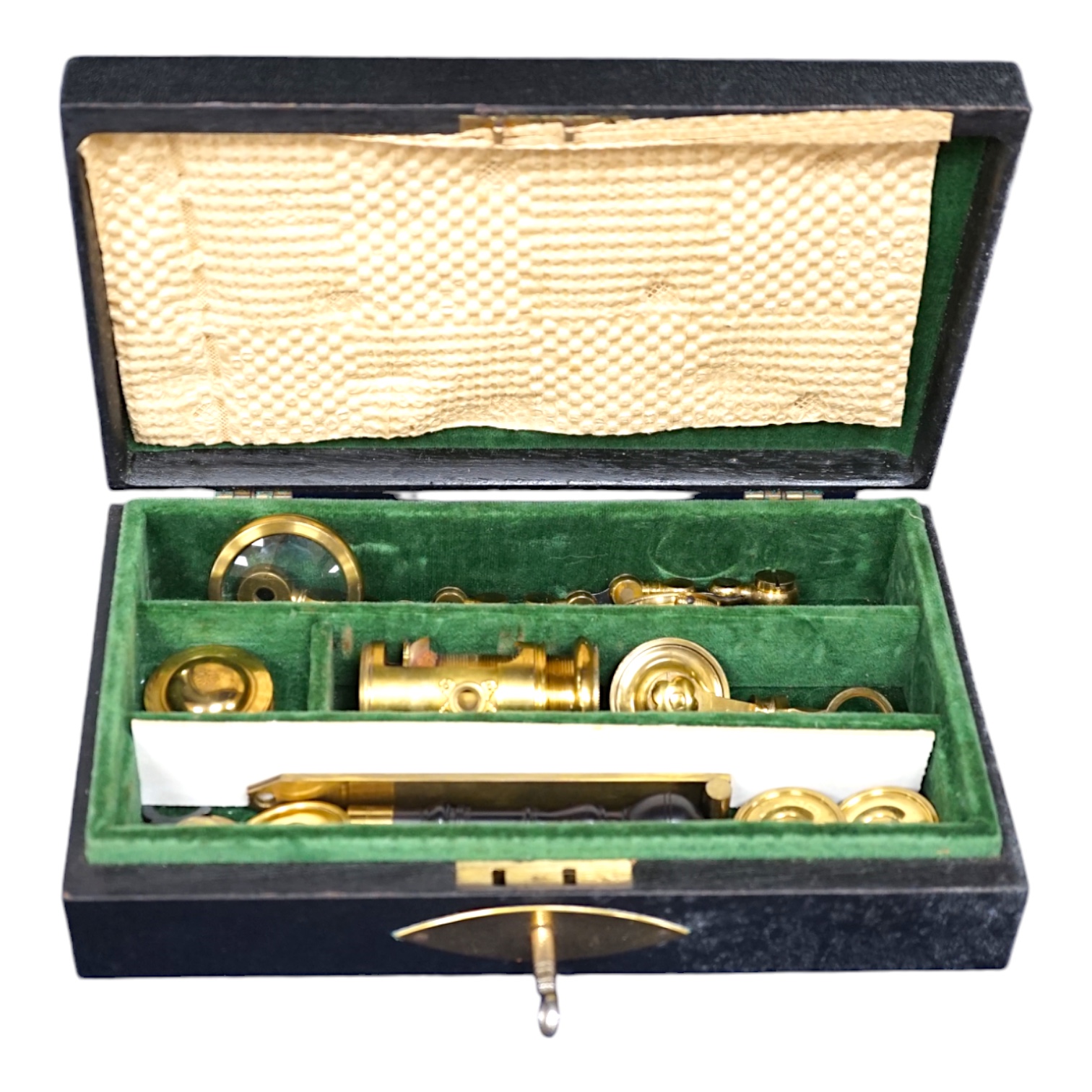 A case containing reproduction cylindrical microscope lenses and parts. Condition - fair.